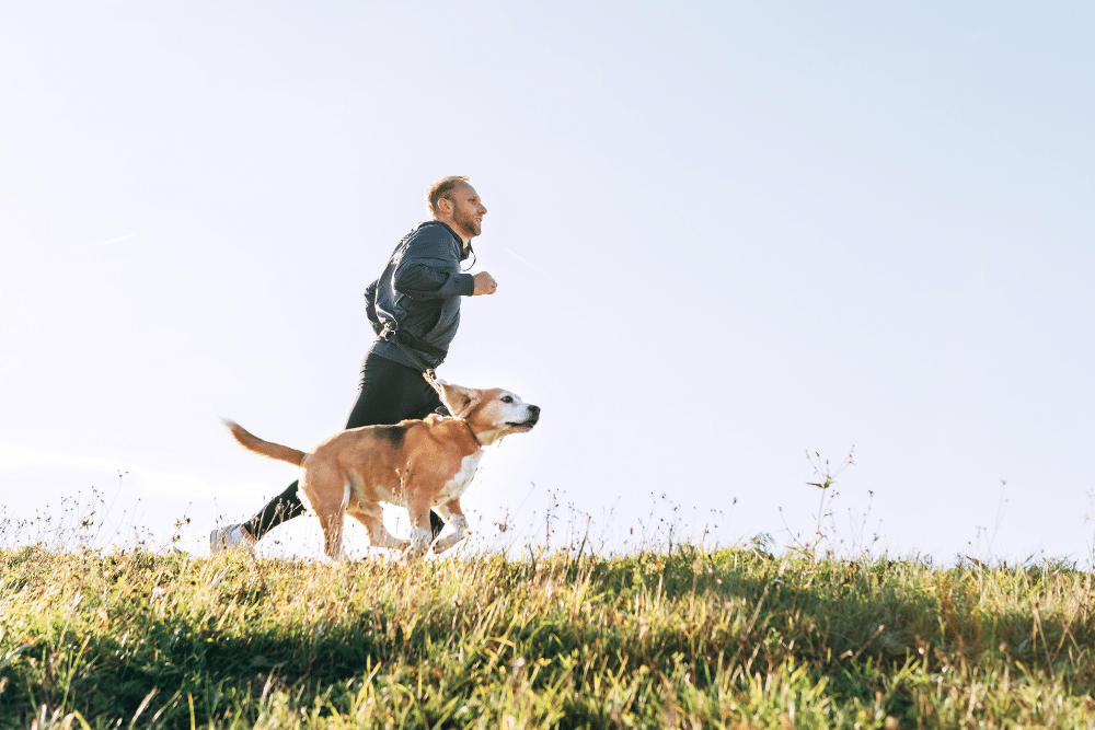 man-running-with-dog
